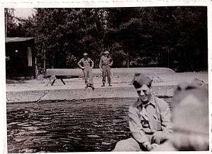 Another pic of the resort. The two MPs in the background appear to be on duty while the soldier in front is not. Not sure if the water is a pool or river. Appears narrow.